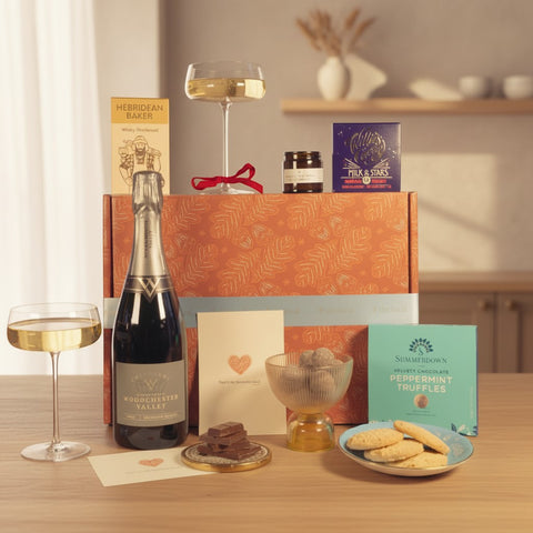 The Local romantic gift box with sparkling wine, chocolate, peppermint truffles, whisky shortbread, and candle.